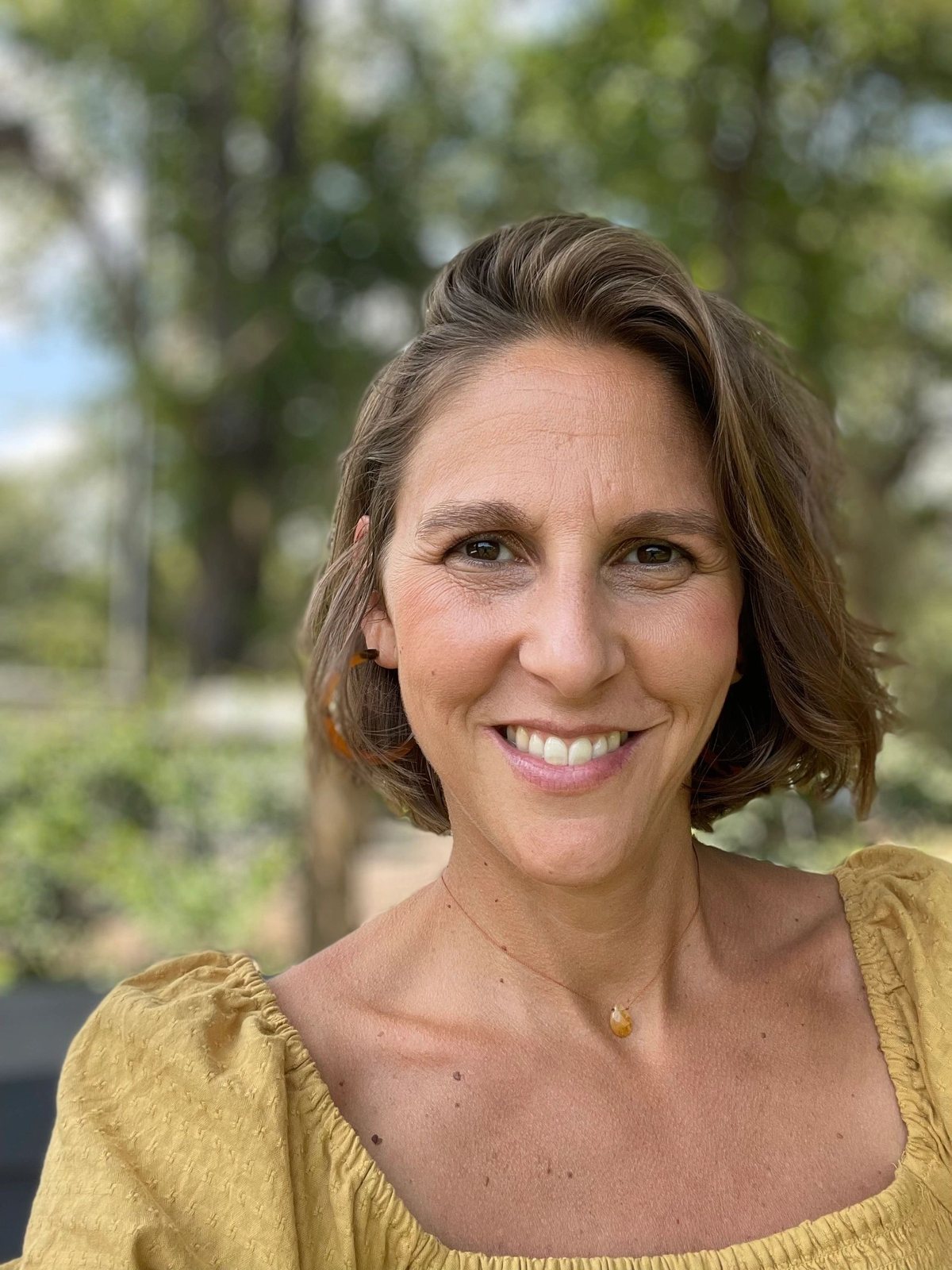 Sarah Dufresne, Licensed Acupuncturist, smiling outdoors